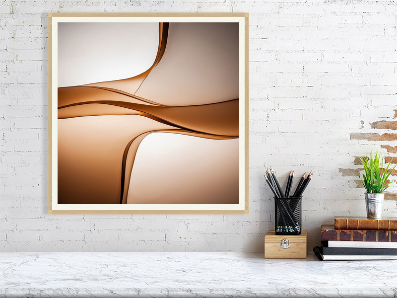Golden Lumina - Sepia Flow by Lucas Vale – Giclée Print, 50cm x 50cm, 19.7in x 19.7in, Oak Frame, placed above a sleek desk in a modern workspace
