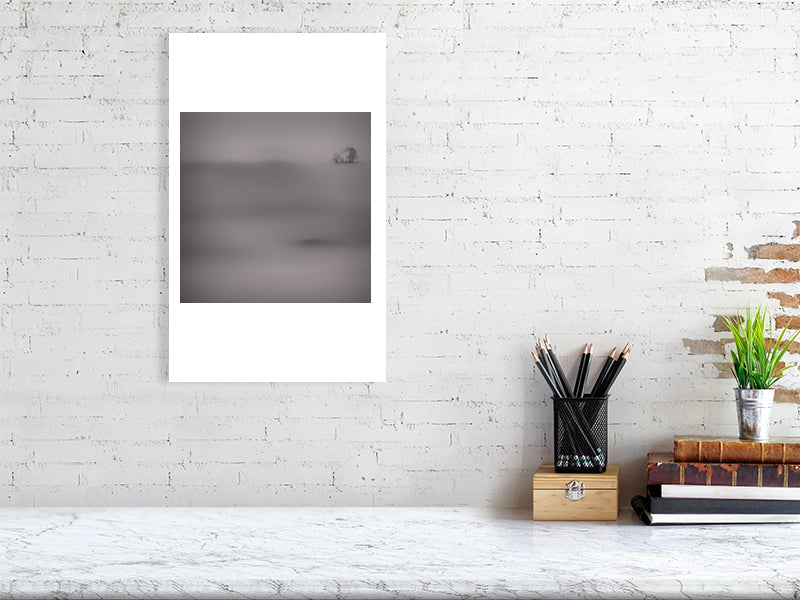 Ethereal Horizons - Pt 1 - Island Of Solitude by Lucas Vale – Giclée Print, 30cm x 45cm, 11.8in x 17.7in, Oak Frame, placed above a sleek desk in a modern workspace
